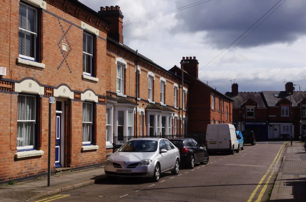 A red-brick Victorian terrace in Leicester with painted cream window dressings and decorative brickwork — period stock characteristic of older Midlands neighbourhoods, including parts of Birstall.