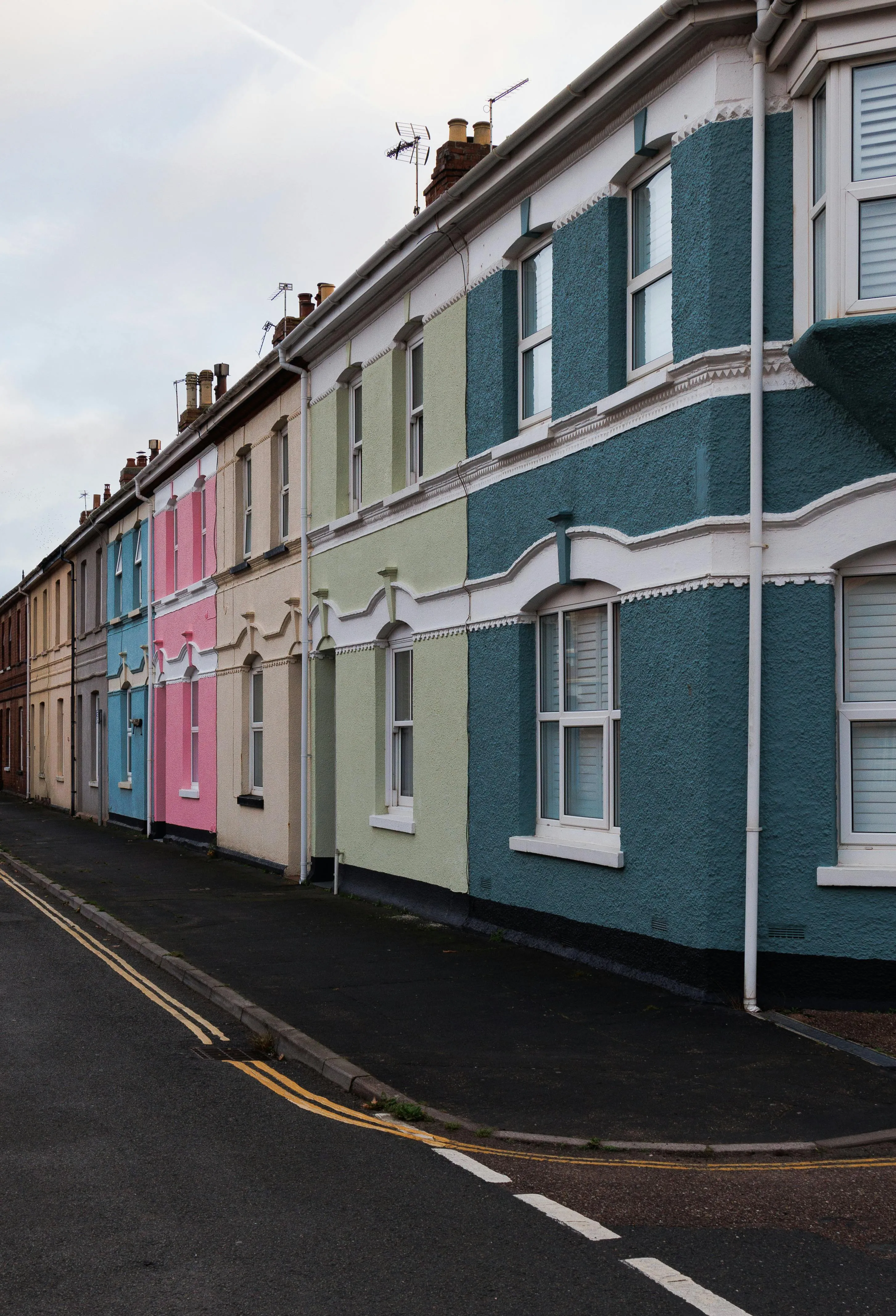 A row of UK Victorian terraced houses on a snowy tree-lined street — period housing stock found across Leicester's inner suburbs, including parts of Western Park.